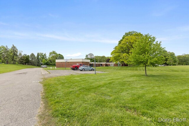 306 W Russell St, Hubbardston, MI 48845 - view of front of property with a front lawn