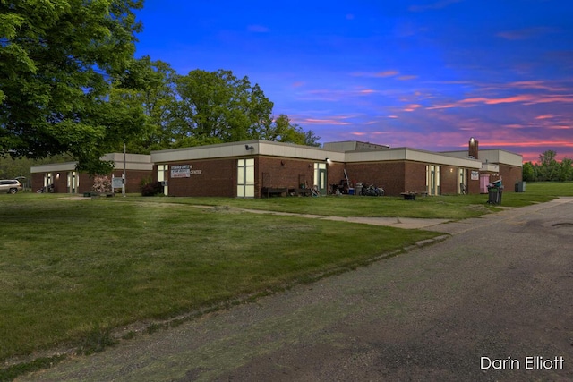 306 W Russell St, Hubbardston, MI 48845 - view of front of house with a front lawn and brick siding