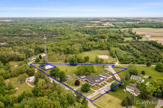 306 W Russell St, Hubbardston, MI 48845 - aerial overview of property's location featuring property parcel outlined and a heavily wooded area