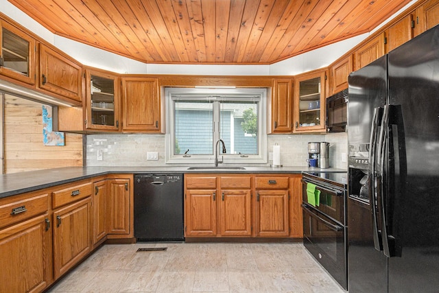 8994 Lenhards Lndg, Clarksville, MI 48815 - kitchen featuring black appliances, brown cabinets, wooden ceiling, decorative backsplash, and crown molding