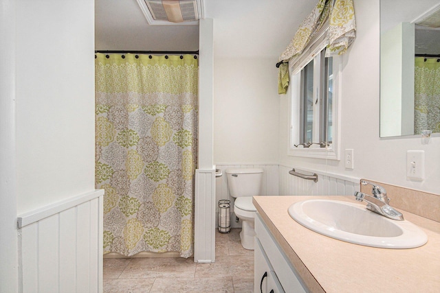 8994 Lenhards Lndg, Clarksville, MI 48815 - full bathroom with vanity, a wainscoted wall, and a shower with shower curtain