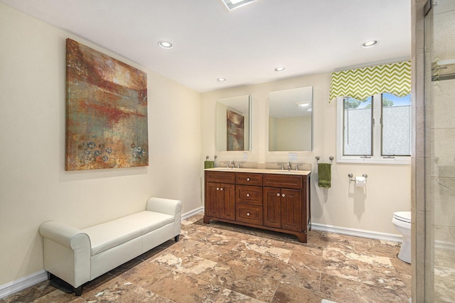 8994 Lenhards Lndg, Clarksville, MI 48815 - full bath with double vanity, recessed lighting, stone finish floors, and an enclosed shower