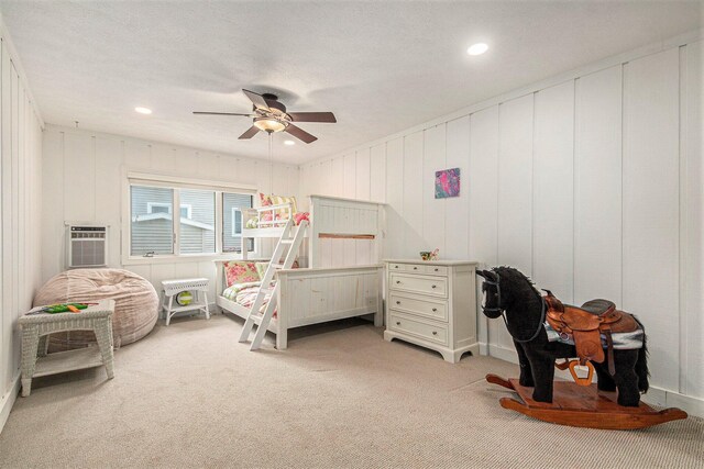 8994 Lenhards Lndg, Clarksville, MI 48815 - bedroom featuring light carpet, a wall mounted AC, recessed lighting, and ceiling fan