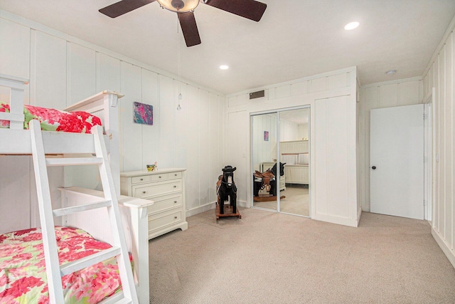 8994 Lenhards Lndg, Clarksville, MI 48815 - bedroom featuring light carpet, recessed lighting, a ceiling fan, a decorative wall, and a closet