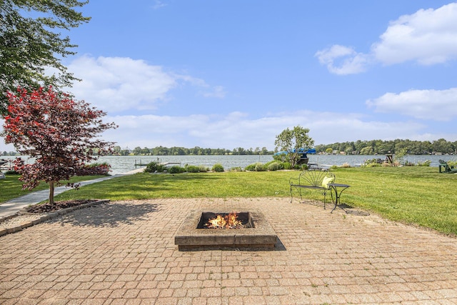 8994 Lenhards Lndg, Clarksville, MI 48815 - view of patio / terrace with a water view and an outdoor fire pit
