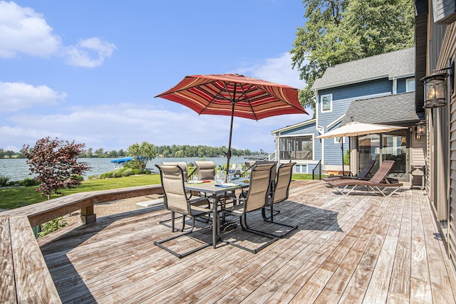 8994 Lenhards Lndg, Clarksville, MI 48815 - wooden deck featuring outdoor dining space, a water view, and a sunroom