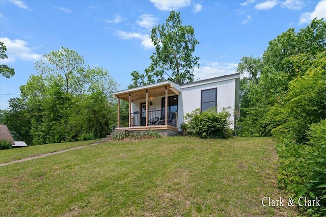 820 Hackett St, Ionia, MI 48846 - view of front of house with a front lawn and covered porch