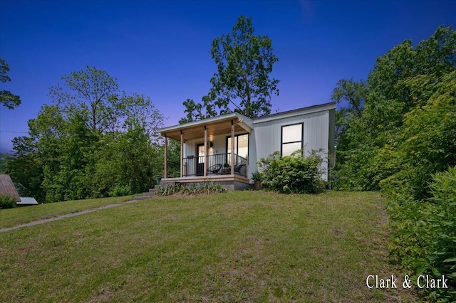 820 Hackett St, Ionia, MI 48846 - view of front facade with covered porch and a front yard