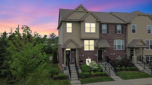 2605 Helmsdale Cir, Rochester, MI 48307 - view of property with brick siding and roof with shingles