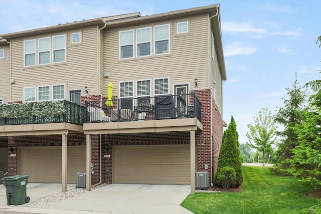 2605 Helmsdale Cir, Rochester, MI 48307 - back of house with brick siding, a garage, and cooling unit