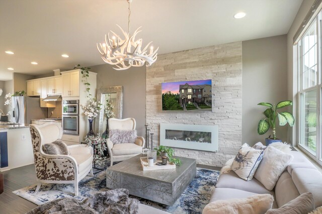 2605 Helmsdale Cir, Rochester, MI 48307 - living area featuring a chandelier, recessed lighting, wood finished floors, and a fireplace
