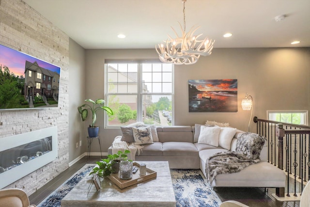 2605 Helmsdale Cir, Rochester, MI 48307 - living room featuring a chandelier, wood finished floors, plenty of natural light, recessed lighting, and a fireplace
