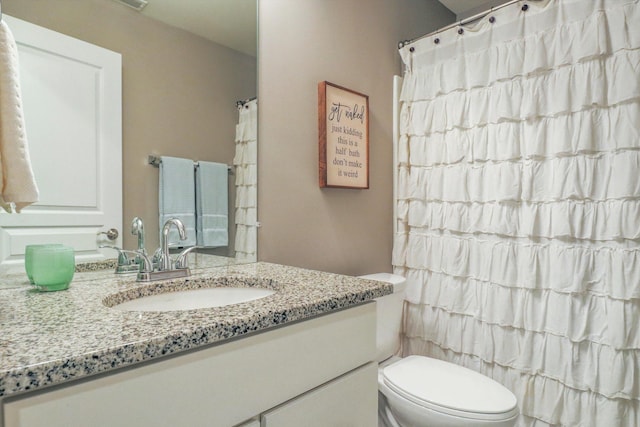 2605 Helmsdale Cir, Rochester, MI 48307 - full bath featuring vanity, toilet, and a shower with shower curtain