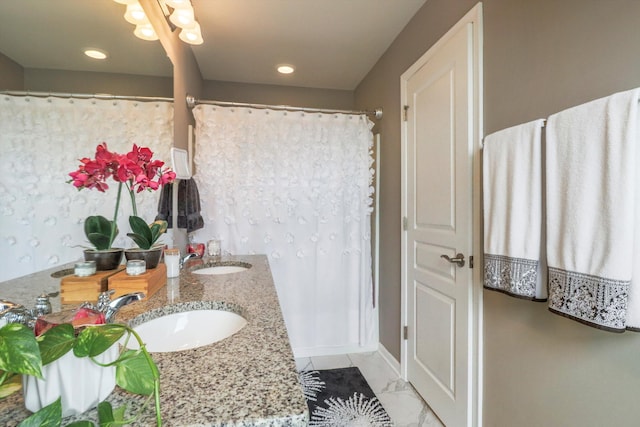 2605 Helmsdale Cir, Rochester, MI 48307 - bathroom with double vanity, recessed lighting, marble look tiles, and baseboards