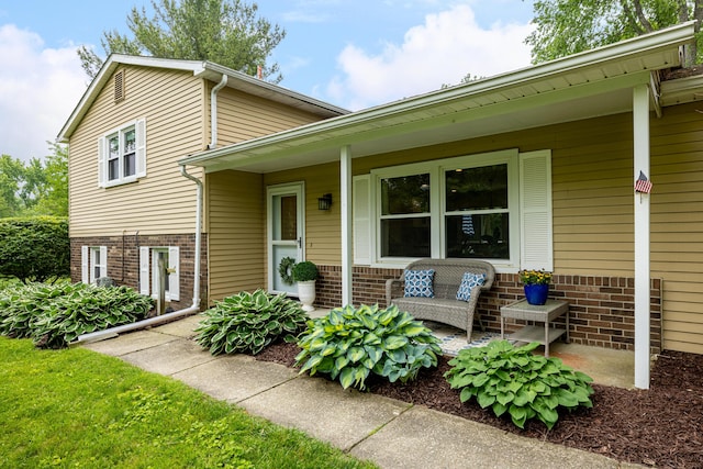 9177 Horseshoe Bnd, Dexter, MI 48130 - view of front of home with brick siding and covered porch