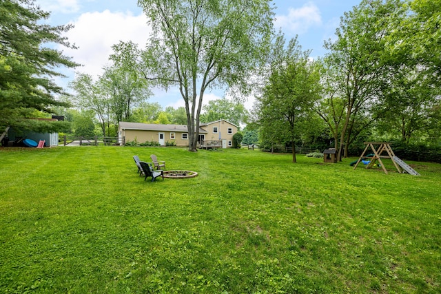 9177 Horseshoe Bnd, Dexter, MI 48130 - view of yard featuring an outdoor fire pit and view of scattered trees