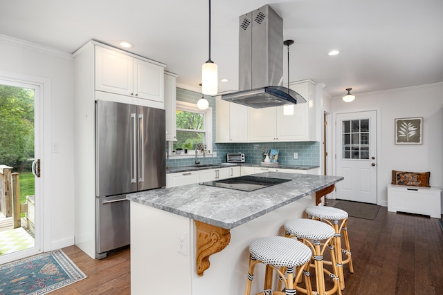 9177 Horseshoe Bnd, Dexter, MI 48130 - kitchen featuring high end fridge, island range hood, ornamental molding, black electric cooktop, and dark wood-style floors