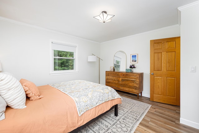 9177 Horseshoe Bnd, Dexter, MI 48130 - bedroom with ornamental molding, wood finished floors, and baseboards