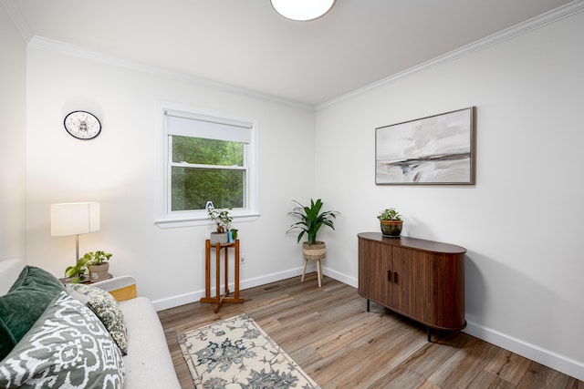 9177 Horseshoe Bnd, Dexter, MI 48130 - sitting room featuring crown molding, baseboards, and wood finished floors