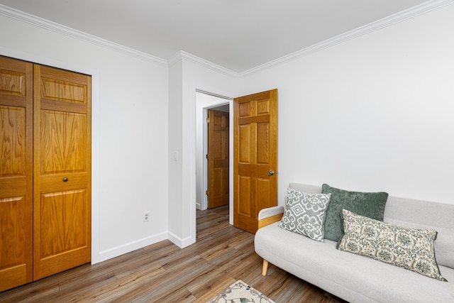 9177 Horseshoe Bnd, Dexter, MI 48130 - living area with wood finished floors, baseboards, and ornamental molding