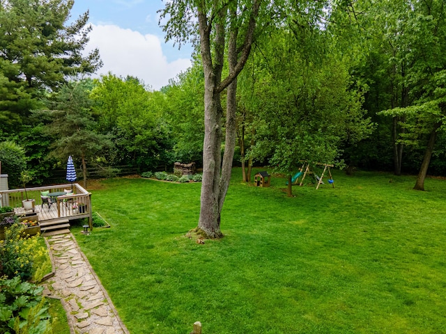 9177 Horseshoe Bnd, Dexter, MI 48130 - view of grassy yard with a deck