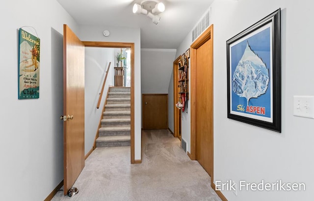 17879 Hidden Dunes Ln Unit D, Spring Lake, MI 49456 - hallway featuring light carpet, stairs, and baseboards