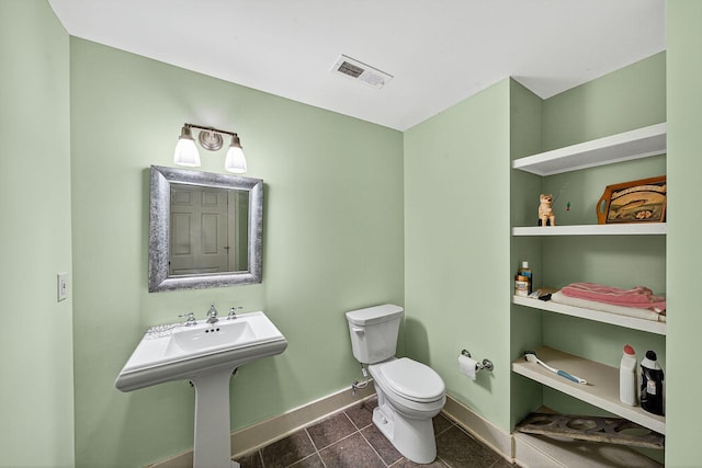 60757 Beechwood Ln, Cassopolis, MI 49031 - half bathroom featuring toilet and tile patterned flooring
