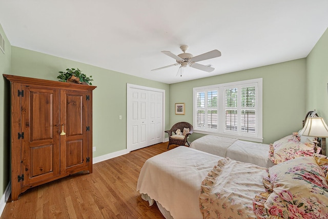 60757 Beechwood Ln, Cassopolis, MI 49031 - bedroom with light wood-style floors, a closet, and ceiling fan