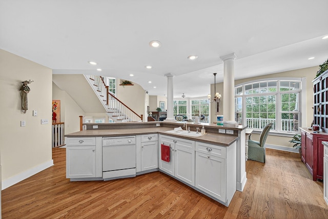 60757 Beechwood Ln, Cassopolis, MI 49031 - kitchen featuring dishwasher, ornate columns, light wood finished floors, and recessed lighting