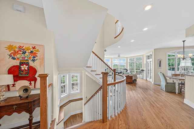 60757 Beechwood Ln, Cassopolis, MI 49031 - staircase with wood finished floors, recessed lighting, ceiling fan, and a chandelier