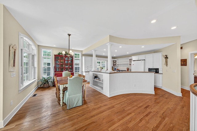 60757 Beechwood Ln, Cassopolis, MI 49031 - dining space featuring decorative columns, healthy amount of natural light, light wood-type flooring, and recessed lighting