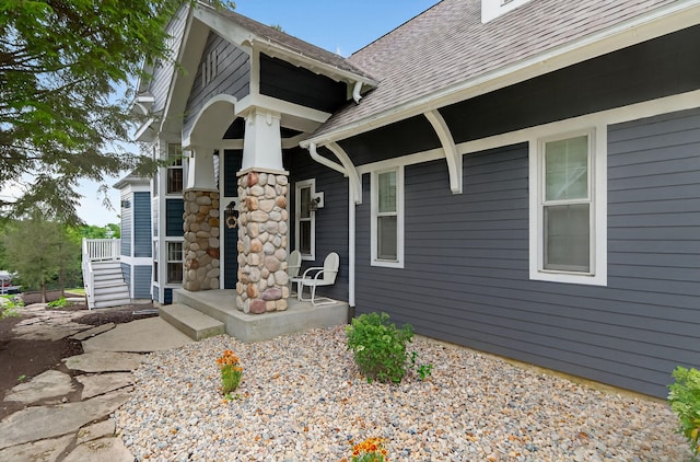 60757 Beechwood Ln, Cassopolis, MI 49031 - view of exterior entry with a shingled roof and covered porch