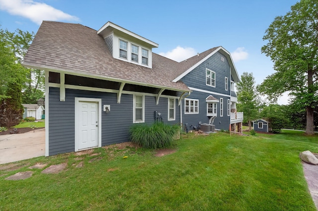 60757 Beechwood Ln, Cassopolis, MI 49031 - rear view of property with a lawn, roof with shingles, and an outbuilding
