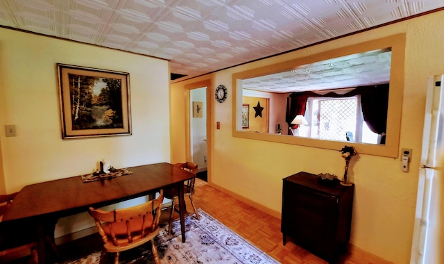 8424 3rd St, Onekama, MI 49675 - dining space with an ornate ceiling and baseboards