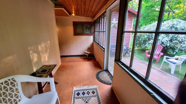 8424 3rd St, Onekama, MI 49675 - corridor featuring wood ceiling and wood finished floors