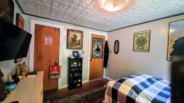 8424 3rd St, Onekama, MI 49675 - bedroom featuring an ornate ceiling and wood finished floors