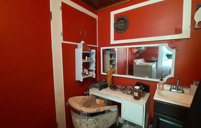 8424 3rd St, Onekama, MI 49675 - bathroom featuring washer / dryer and vanity