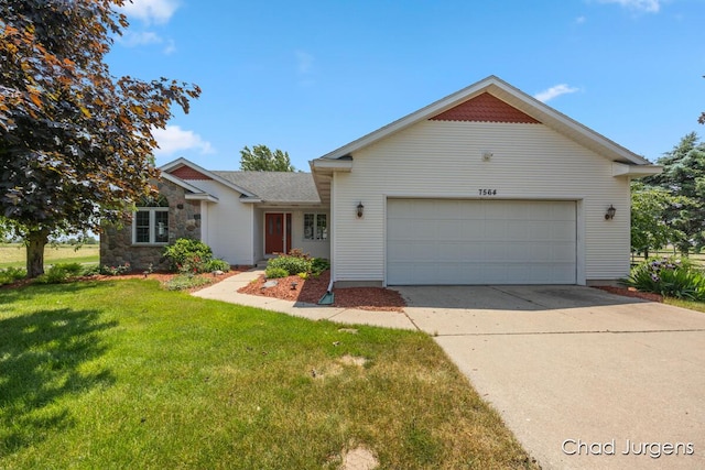 7564 Quincy St, Zeeland, MI 49464 - view of front of home with a garage, a front yard, and driveway
