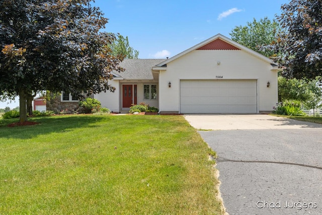 7564 Quincy St, Zeeland, MI 49464 - view of front of property with an attached garage, concrete driveway, a front lawn, and a shingled roof