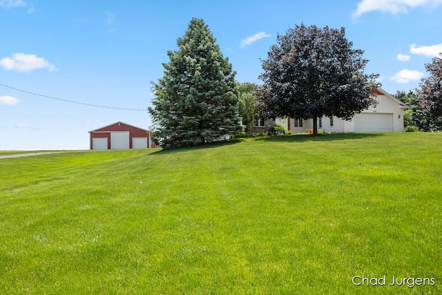 7564 Quincy St, Zeeland, MI 49464 - view of green lawn with a detached garage