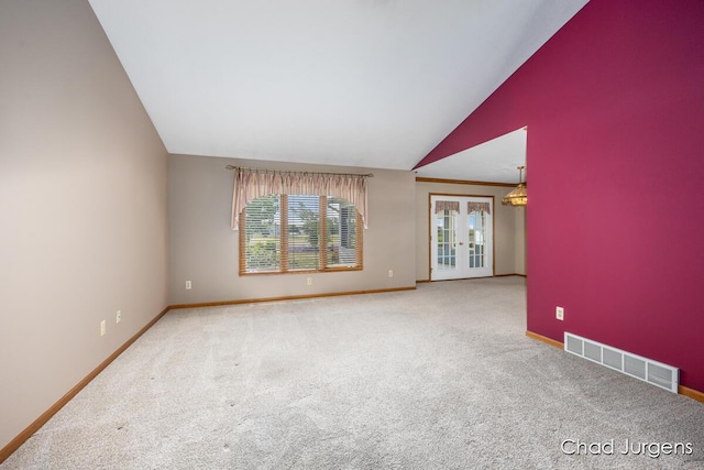 7564 Quincy St, Zeeland, MI 49464 - carpeted empty room featuring french doors and lofted ceiling