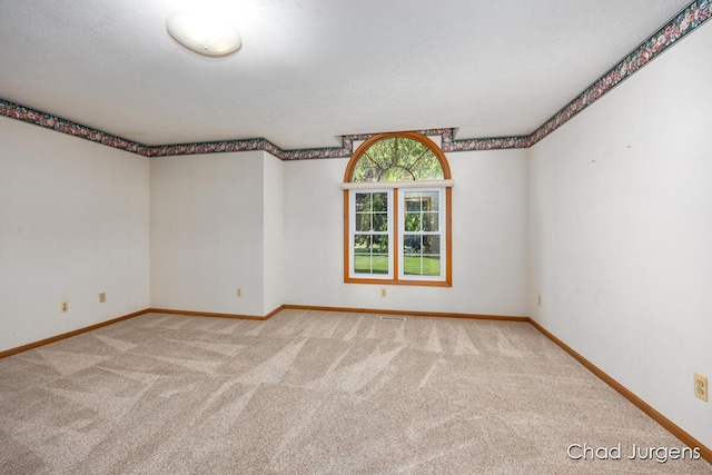 7564 Quincy St, Zeeland, MI 49464 - empty room featuring light carpet and baseboards