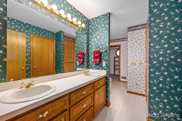 7564 Quincy St, Zeeland, MI 49464 - bathroom featuring wallpapered walls and double vanity