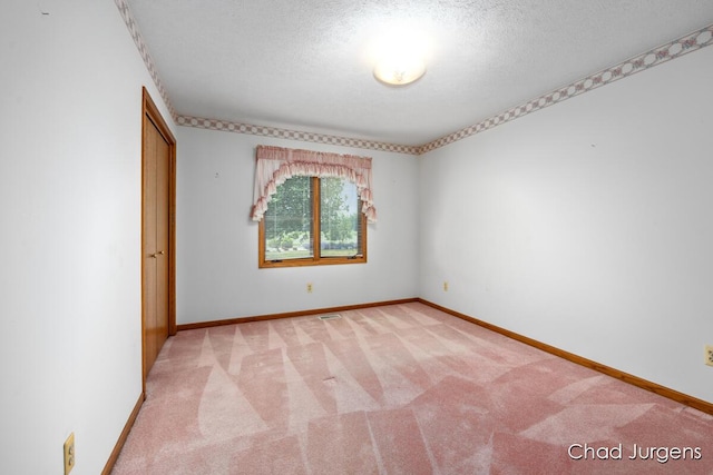 7564 Quincy St, Zeeland, MI 49464 - unfurnished room with light colored carpet and a textured ceiling