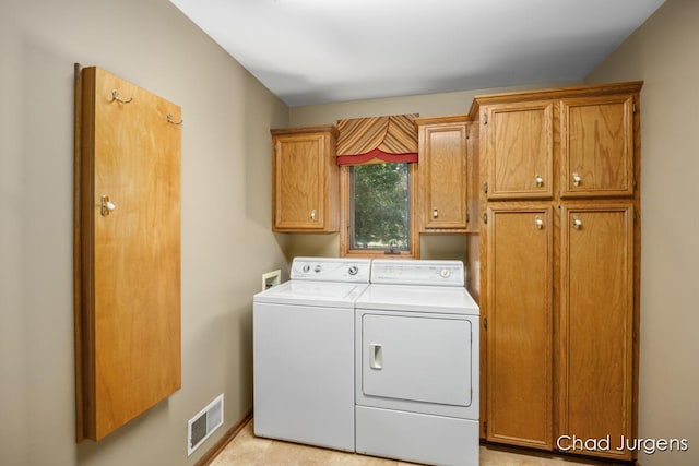 7564 Quincy St, Zeeland, MI 49464 - washroom with cabinet space and washing machine and clothes dryer