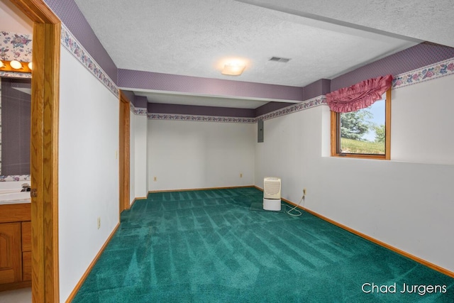 7564 Quincy St, Zeeland, MI 49464 - below grade area featuring carpet flooring and a textured ceiling