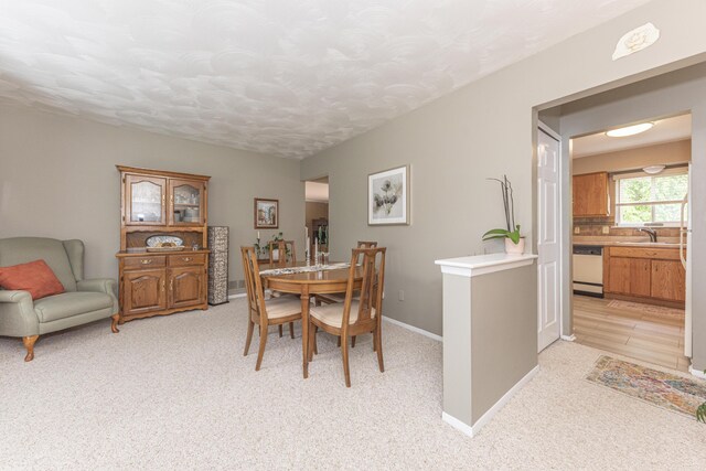 3929 Beech Dr, Ypsilanti, MI 48197 - dining space with light carpet and a textured ceiling