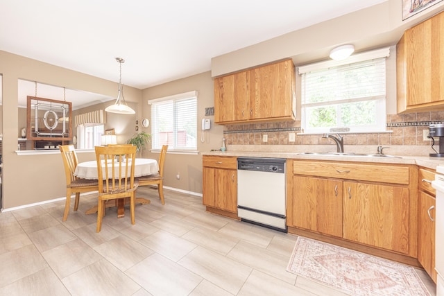 3929 Beech Dr, Ypsilanti, MI 48197 - kitchen featuring dishwasher, tasteful backsplash, light countertops, and healthy amount of natural light