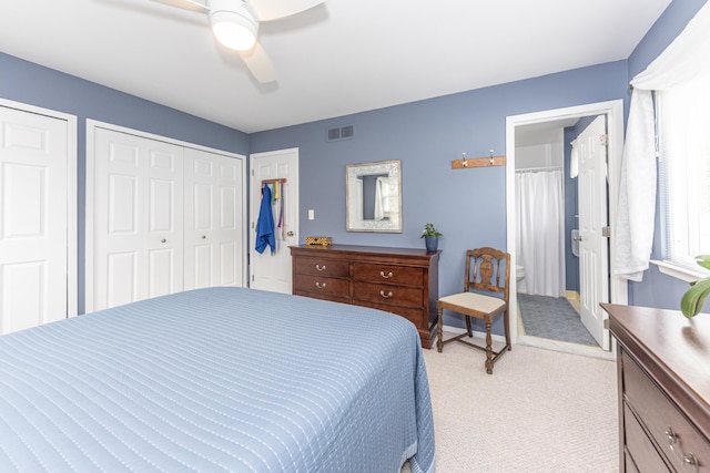 3929 Beech Dr, Ypsilanti, MI 48197 - bedroom featuring light carpet, a ceiling fan, connected bathroom, and multiple closets