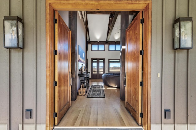 10258 Burgoyne Rd, Berrien Springs, MI 49103 - corridor with light wood-style flooring, french doors, and beam ceiling